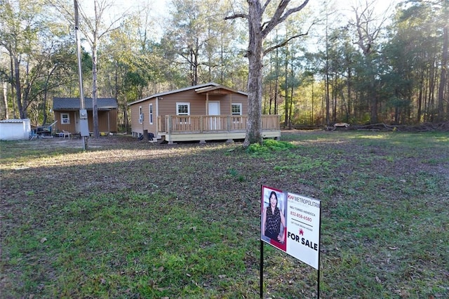 view of yard featuring a wooden deck