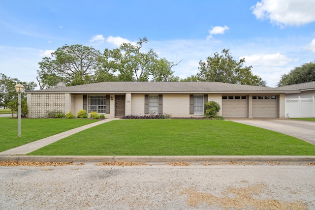 ranch-style house with a front yard and a garage