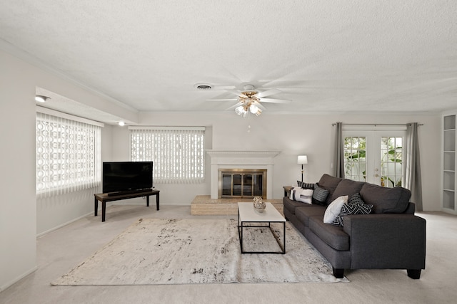 living room with light carpet, a textured ceiling, and ornamental molding