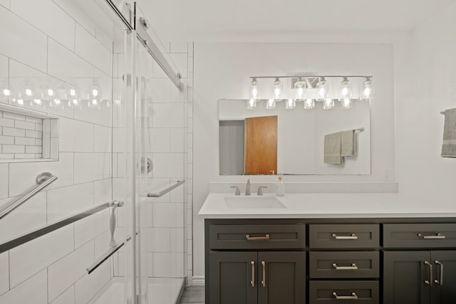 bathroom with vanity and an enclosed shower