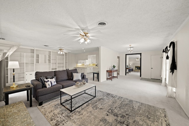 carpeted living room with a textured ceiling and ceiling fan