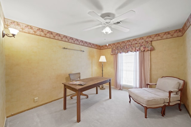 office area with ceiling fan and light carpet