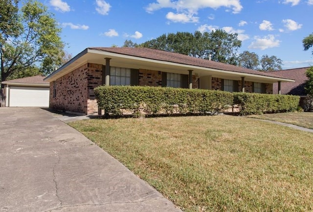 ranch-style home with a front lawn and a garage