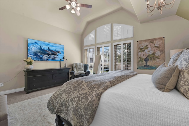 carpeted bedroom with lofted ceiling and ceiling fan with notable chandelier