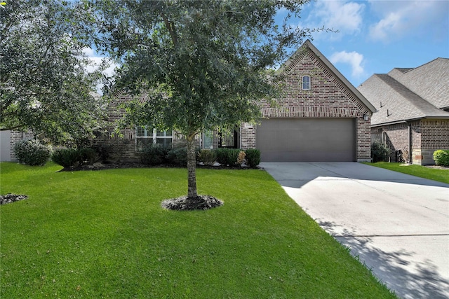 view of front of home with a front lawn and a garage