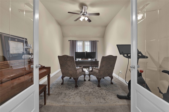 carpeted home office with french doors, vaulted ceiling, and ceiling fan