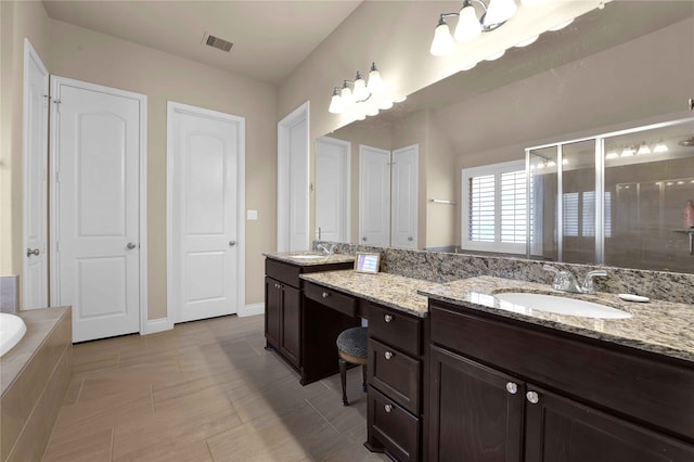 bathroom with vanity, plus walk in shower, and tile patterned floors