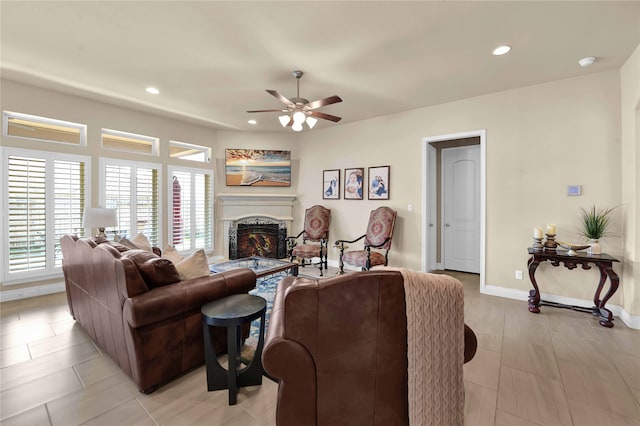 living room featuring ceiling fan and light tile patterned floors