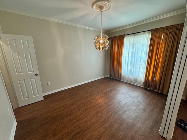 empty room featuring a notable chandelier, crown molding, and dark hardwood / wood-style flooring