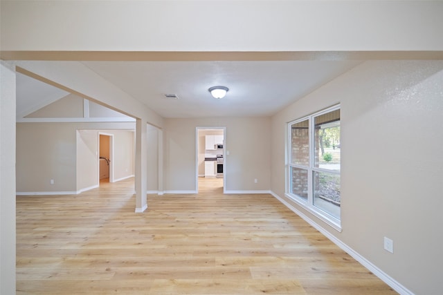 unfurnished room featuring light hardwood / wood-style flooring