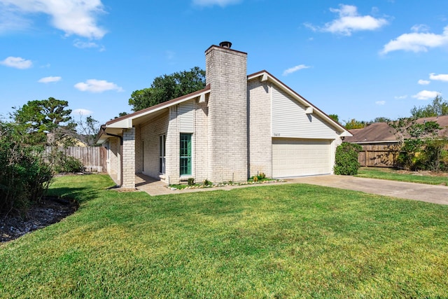 view of home's exterior featuring a garage and a lawn