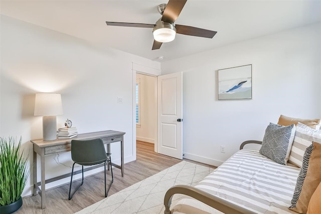 office with light hardwood / wood-style floors and ceiling fan