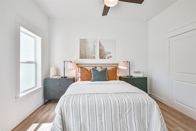 bedroom featuring light wood-type flooring and ceiling fan