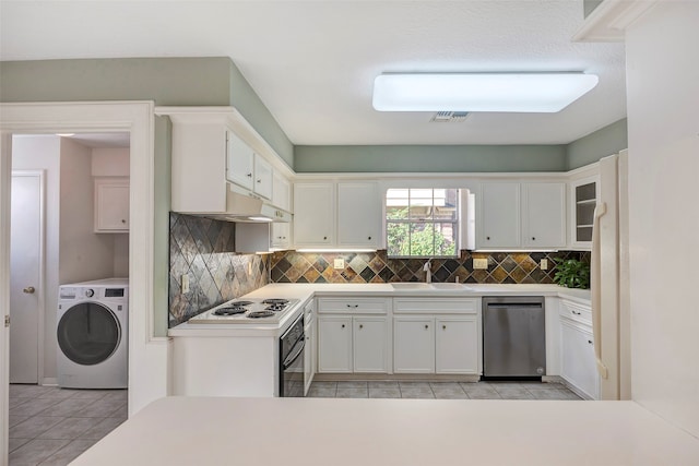 kitchen with white gas stovetop, dishwasher, washer / dryer, sink, and white cabinetry