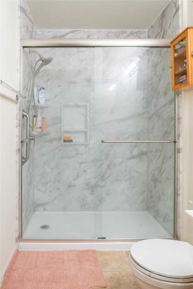5618 Tiger Lilly Way, Houston, TX 77085 - bathroom featuring toilet and a marble finish shower
