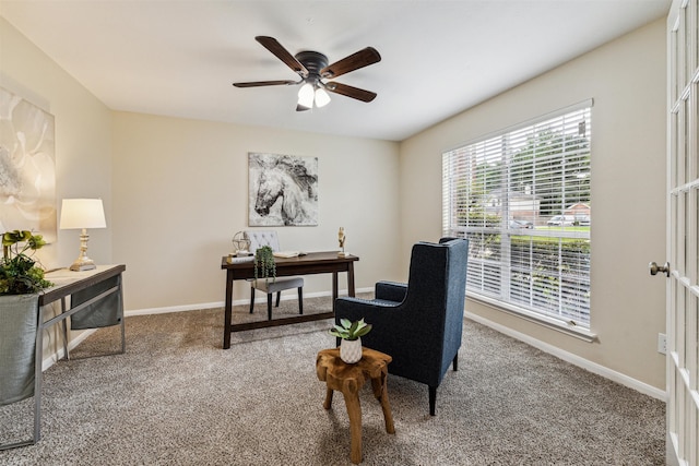 office area with ceiling fan and carpet