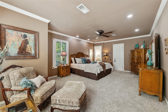 carpeted bedroom with ceiling fan and crown molding