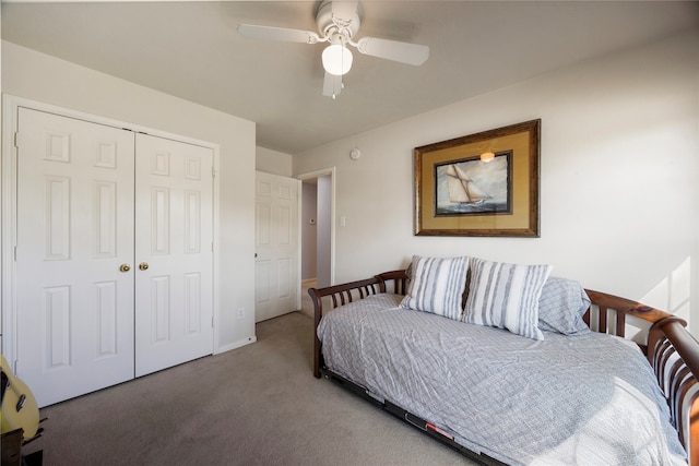 carpeted bedroom featuring a closet and ceiling fan