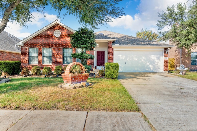 view of front of home featuring a garage and a front lawn