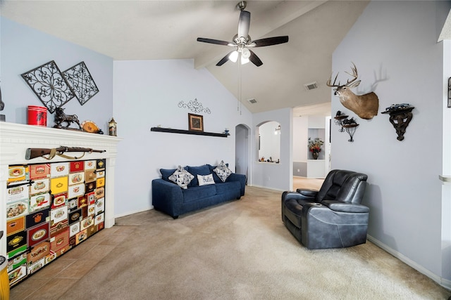 living area featuring ceiling fan, carpet flooring, and vaulted ceiling