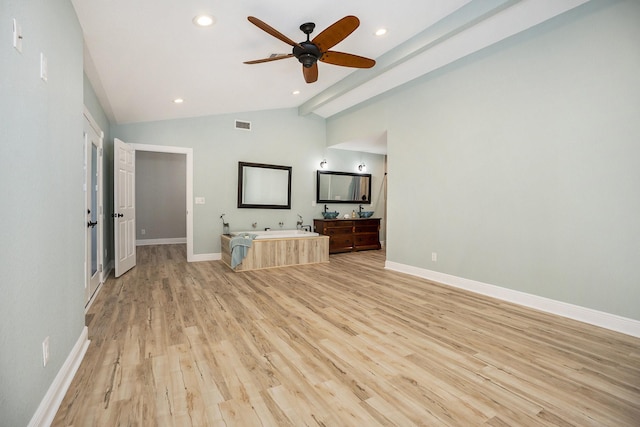 unfurnished living room featuring high vaulted ceiling, light hardwood / wood-style flooring, and ceiling fan