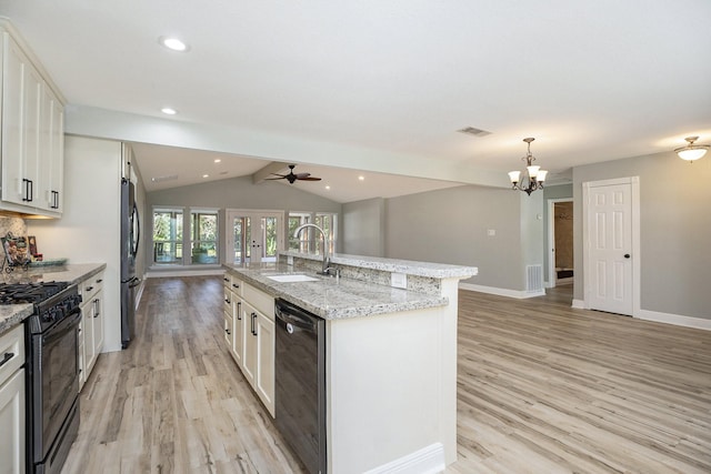 kitchen with white cabinetry, an island with sink, and black appliances