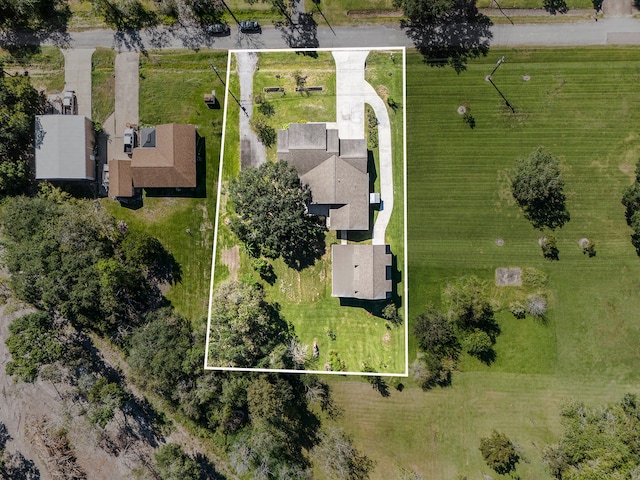 birds eye view of property with a rural view