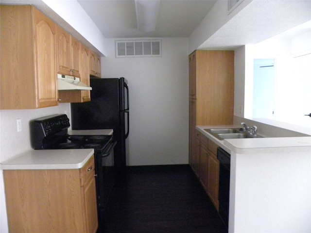 kitchen featuring black appliances, sink, and light brown cabinets