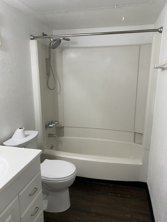 full bathroom featuring vanity, toilet, bathtub / shower combination, and hardwood / wood-style flooring