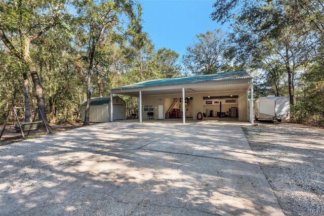 view of parking / parking lot with a carport