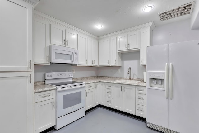 kitchen with sink, white cabinets, light stone counters, a textured ceiling, and white appliances