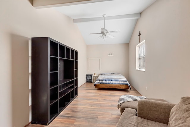 bedroom featuring beamed ceiling, light hardwood / wood-style flooring, high vaulted ceiling, and ceiling fan