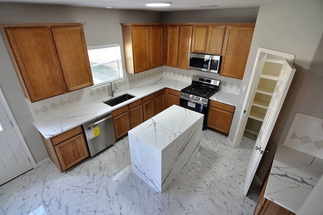 kitchen featuring appliances with stainless steel finishes, light stone countertops, sink, and backsplash