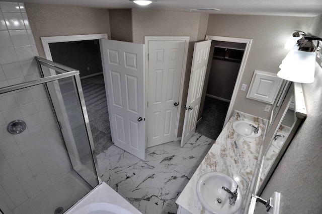 bathroom featuring vanity and shower with separate bathtub