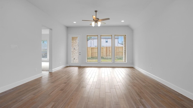 unfurnished room with hardwood / wood-style floors and ceiling fan