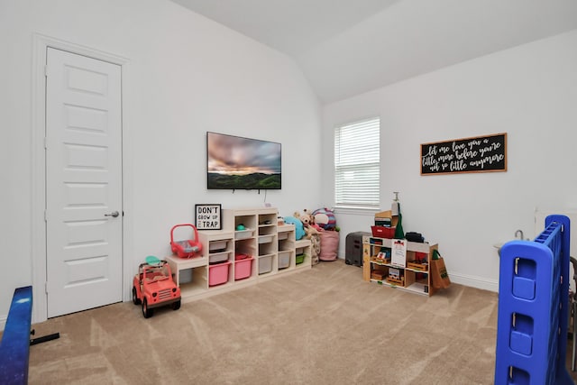 playroom with vaulted ceiling and light carpet