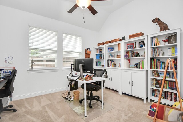 carpeted home office featuring ceiling fan and vaulted ceiling