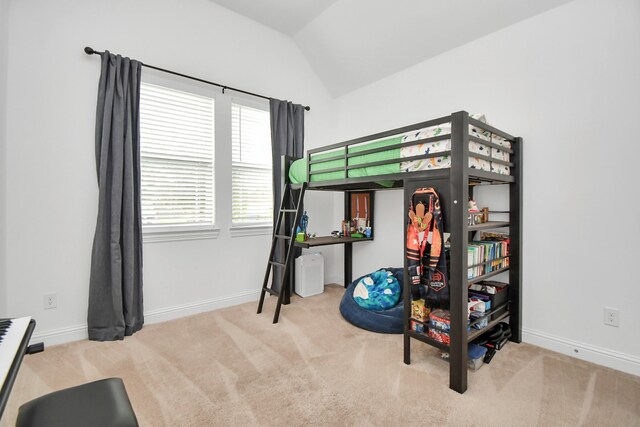 carpeted bedroom featuring lofted ceiling