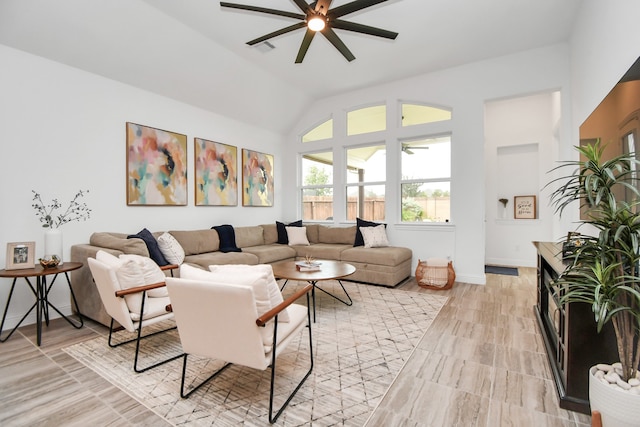 living room featuring lofted ceiling and ceiling fan