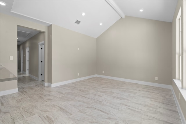 spare room featuring vaulted ceiling with beams