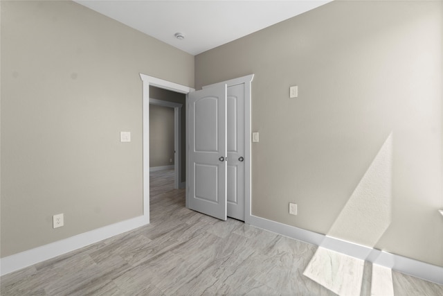 unfurnished room featuring light wood-type flooring