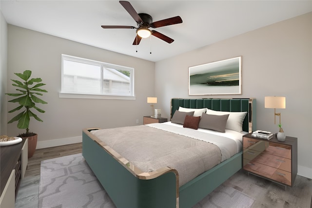 bedroom with hardwood / wood-style floors and ceiling fan