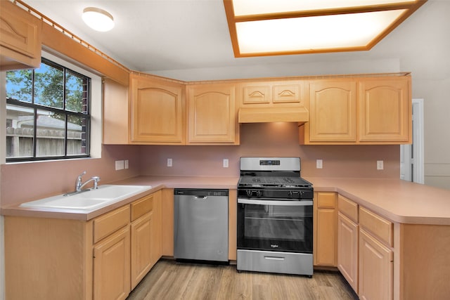 kitchen with sink, light brown cabinetry, stainless steel appliances, and light wood-type flooring