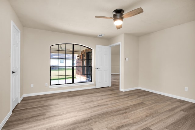 spare room with ceiling fan and light hardwood / wood-style floors