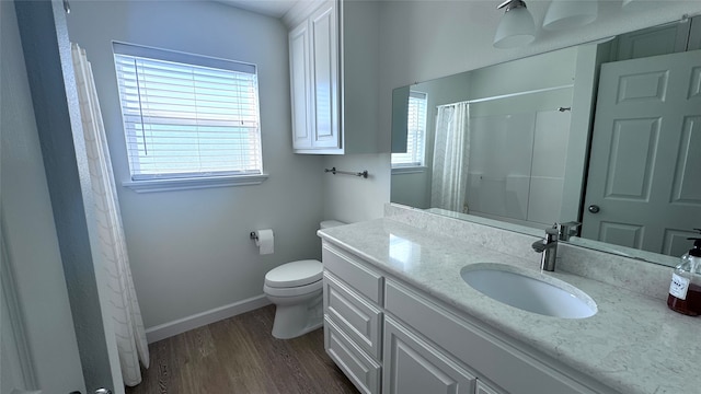 bathroom featuring toilet, vanity, hardwood / wood-style floors, and a shower with shower curtain