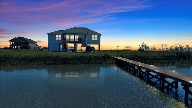 exterior space with a water view and a balcony