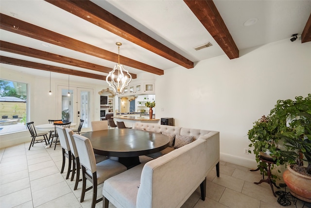 tiled dining area with a notable chandelier and beamed ceiling