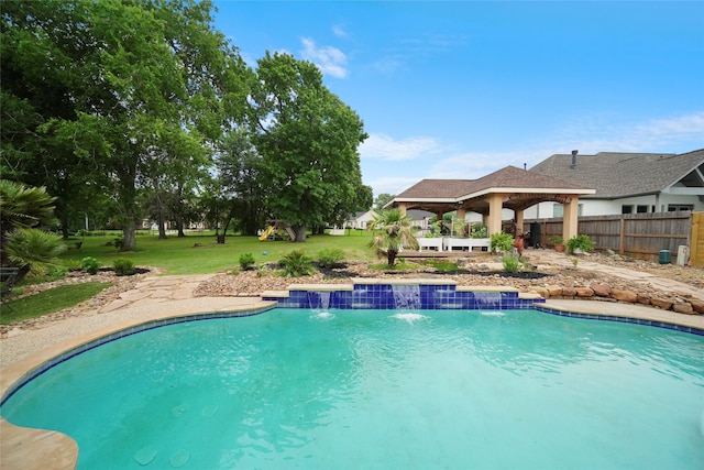 view of pool with a gazebo, a yard, and pool water feature