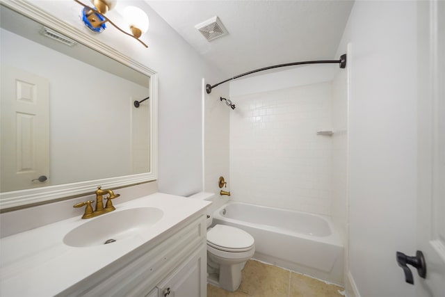 full bathroom featuring tiled shower / bath, vanity, toilet, and tile patterned floors