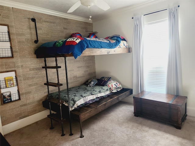 bedroom featuring carpet, crown molding, and ceiling fan